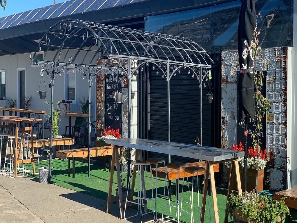 Sunny front of new cafe/bar where you can sit and relax